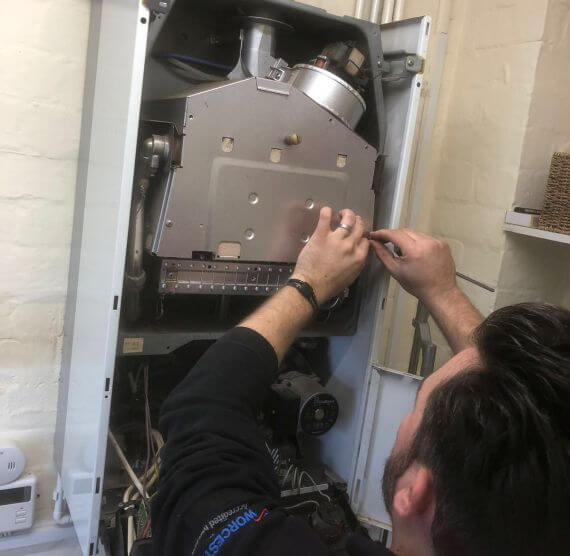 Boiler Service - Engineer working on a boiler