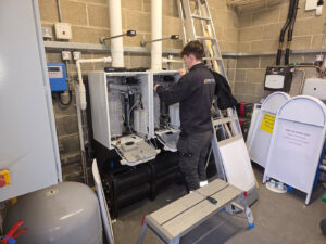 Planned Preventative Maintenance - this image shows one of our milton keynes plumbing engineers performing planned preventative maintenance