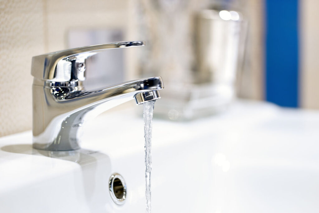 Why You Might Have Low Water Pressure - this image shows a slow running tap