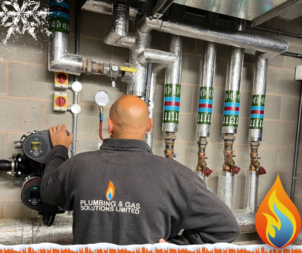 Preparing for the Christmas Shutdown - Essential Plumbing & Heating Tips for Your Business this image shows our engineer Mike with fully lagged pipes