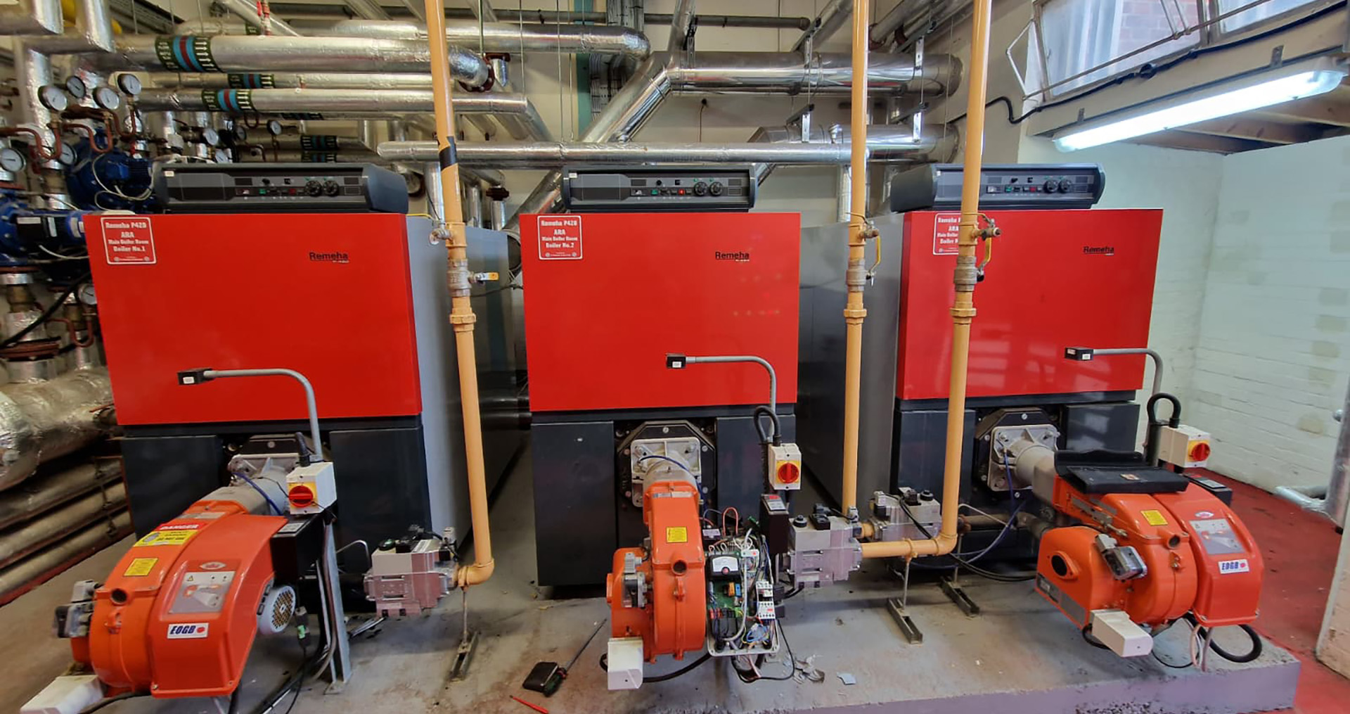 Commercial boiler plant with multiple industrial gas boilers installed and maintained by Plumbing & Gas Solutions for Facilities Management buildings. Keeping Facilities Flowing