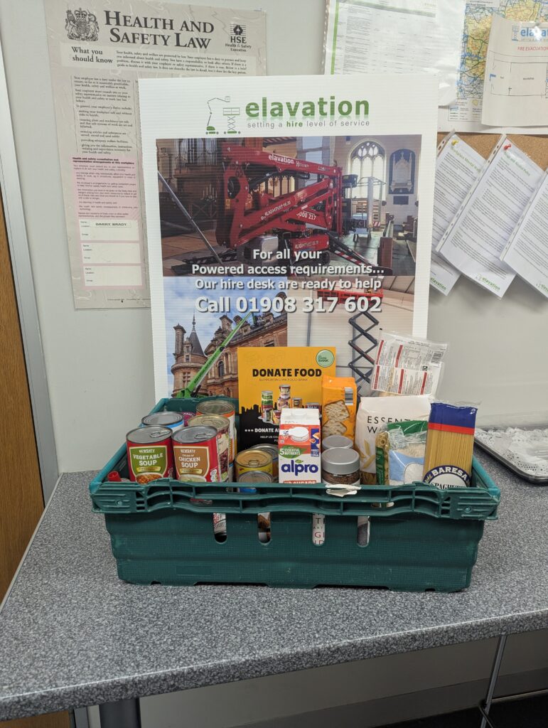 Donation crate with food items at Elevation Wolverton office supporting MK Food Bank campaign
