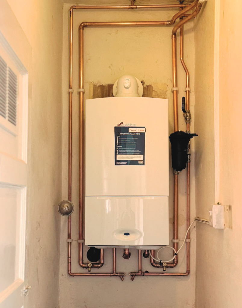 Domestic boiler installation with copper pipework in Milton Keynes home