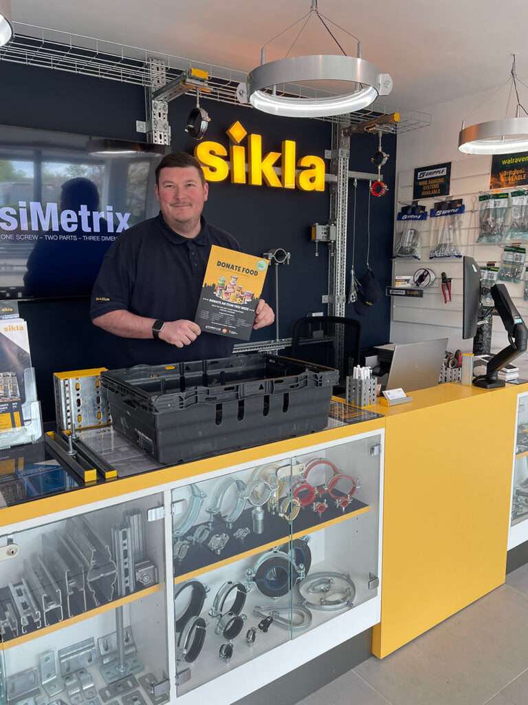 PGS Group delivering MK Food Bank donation crate to Sikla showroom in Milton Keynes for local food collection campaign