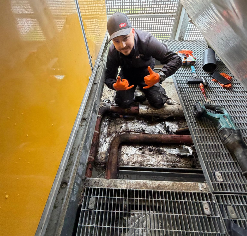 Kellan fixing corroded pipework