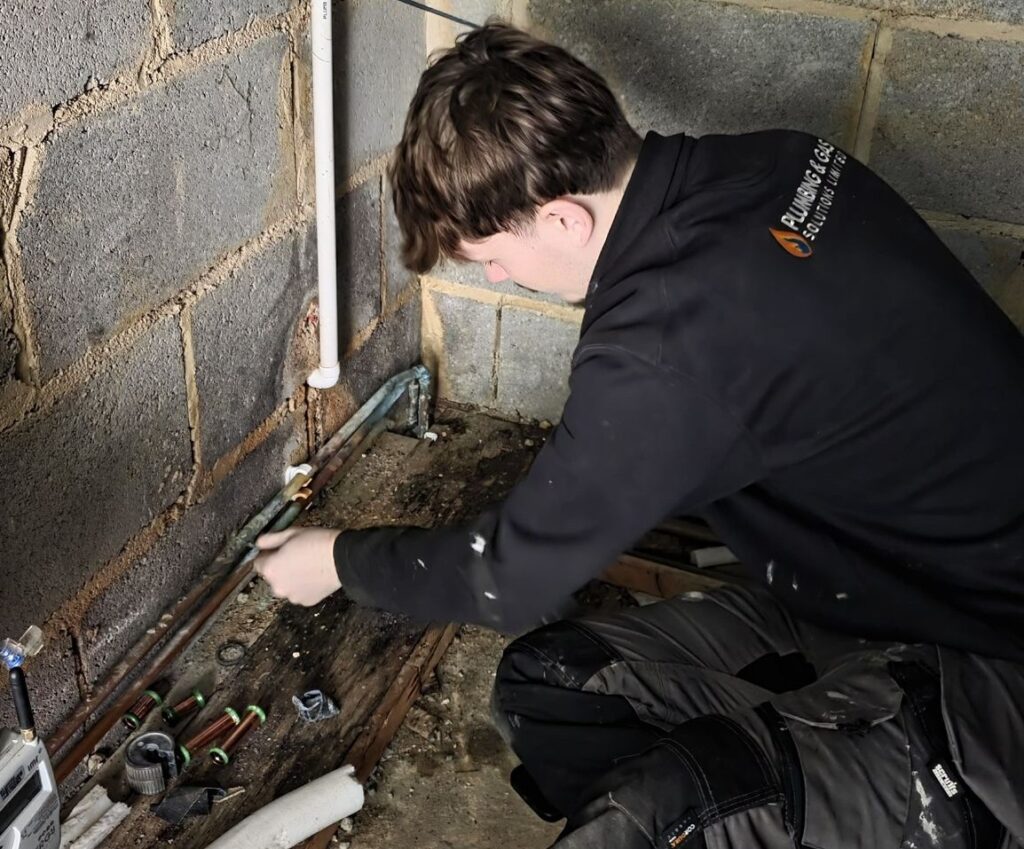 Our apprentice George repairing a leak for our customers pipework