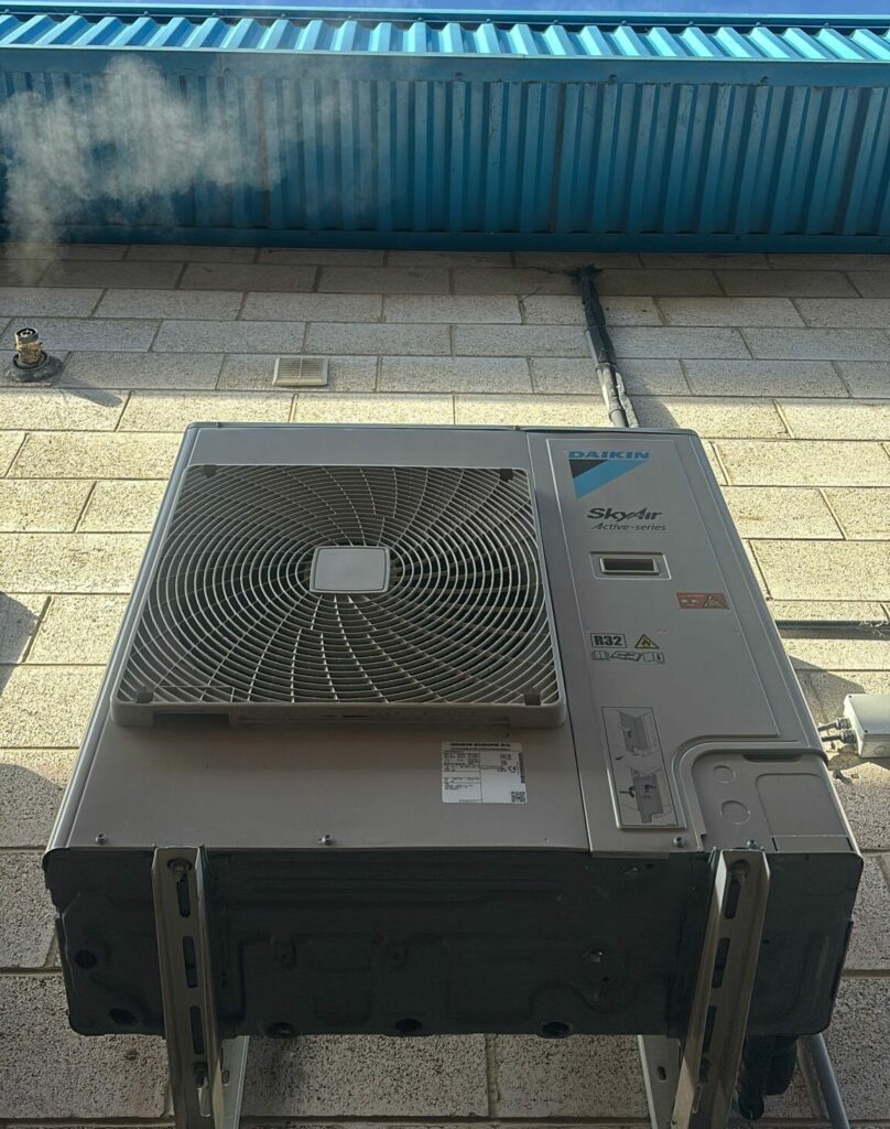 Commercial air conditioning unit installed on an external building wall