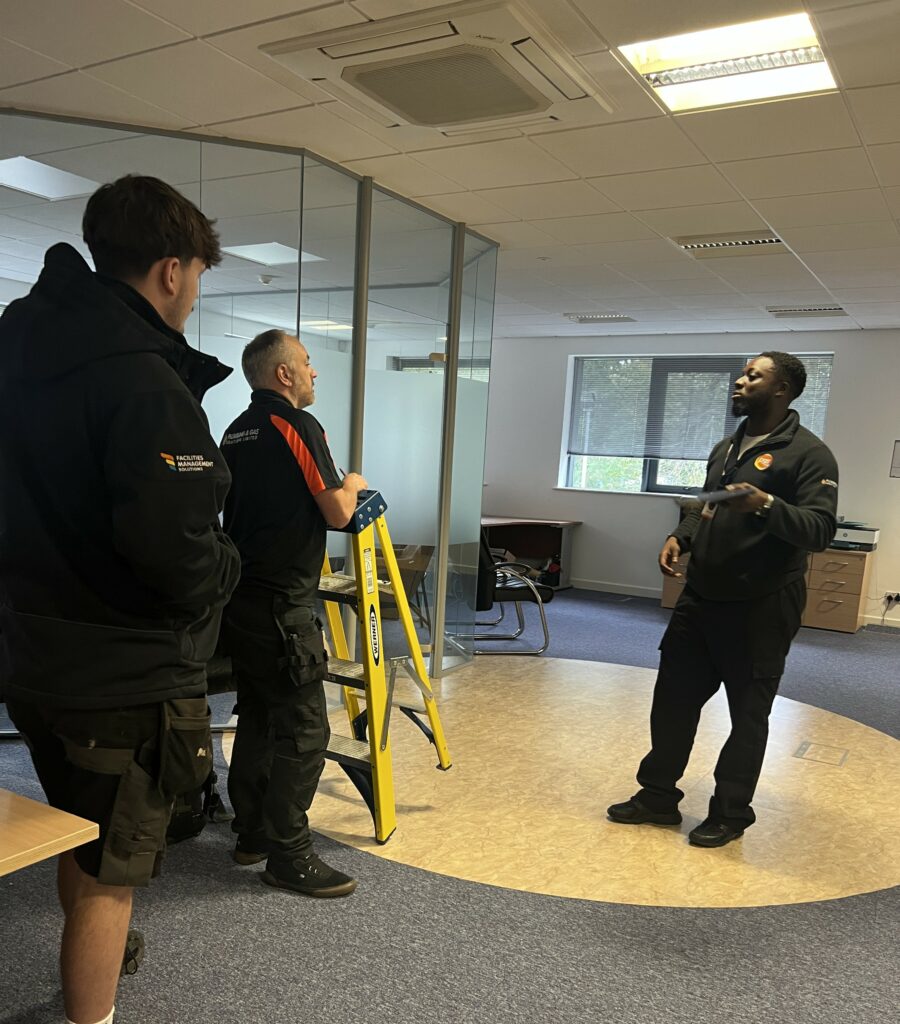 Rob carrying out a HVAC survey with our engineer george and Ayden an FM Project Manager