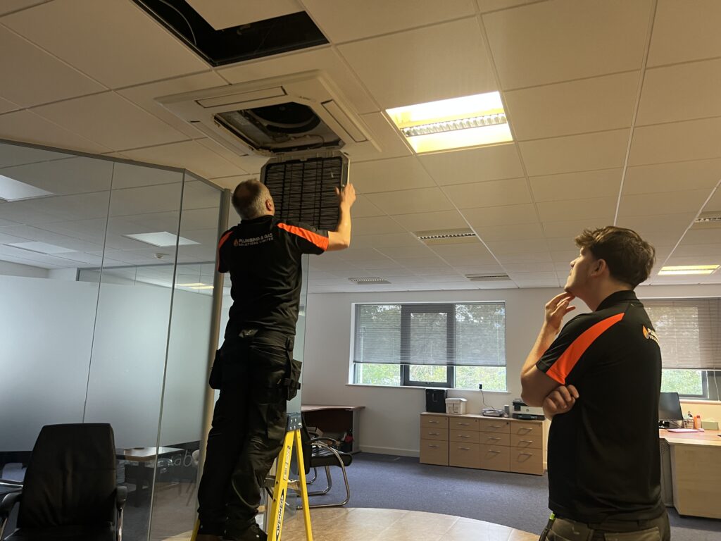Rob opening up the AC unit for investigation